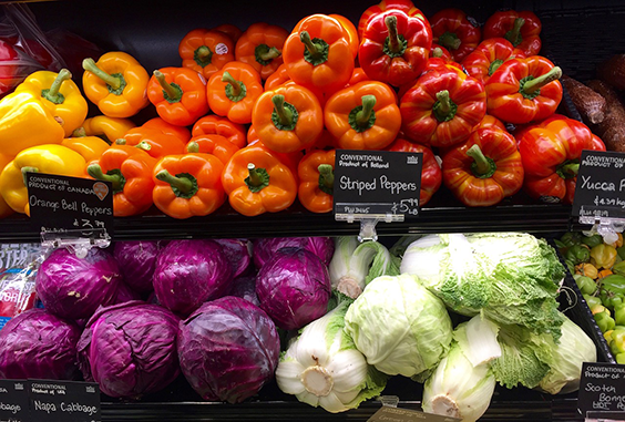bell peppers, cabbage and other vegetables in grocery store