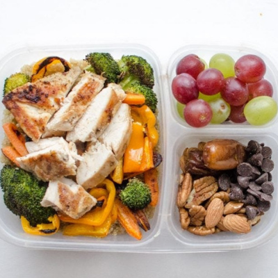cooked quinoa roasted veggies and chicken breast bento box